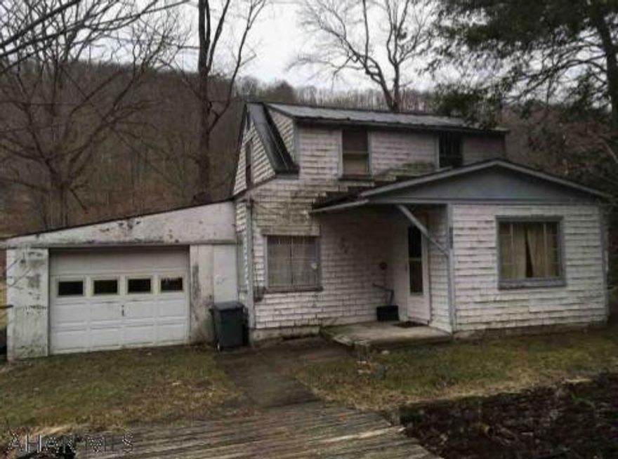 Handyman special! Two bedroom one bath home in Maple Hollow. This property includes a 1 car attached garaged and enclosed porch with laundry. Motivated sellers. Call listing agent for more information or for your tour today.