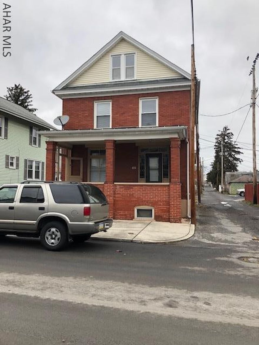Two and half story brick home. 3 Bedrooms, 1 bath, living room with hardwood floors. Old world charm lead glass windows, pocket doors between living room and dining room. Window seat in dining room. Third floor finished, could make a great office, media room or bedroom. Sold As Is