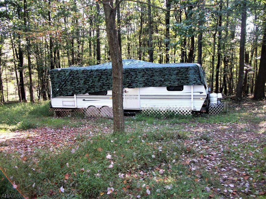 Hunter's Paradise! 10.05 acres of land located near Buchanon State Forest. This parcel has underground electric to the site, rolling topography, a stream and is wooded. It contains a mixture of oak, cherry, ash, locust and pine. There are plenty of deer, turkey and squirrels making this area home. Included is a Jayco 1999 30-foot travel trailer in good condition that sleeps six. It has propane and/or electric heat, a propane stove, air conditioning, and a refrigerator/freezer that can run on propane or electricity. The site has not been perk tested. For GPS search, use 599 Artemas Road as your destination. The property is directly across the road.