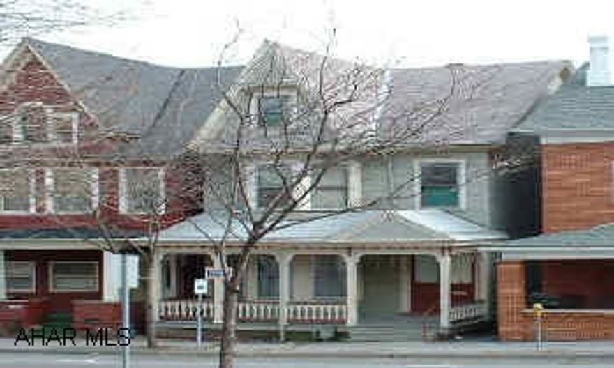 Current use is single family home, but one 2nd floor bedroom is a kitchen.  Could be duplexed very easily.  Estimated age of home 75-100 years