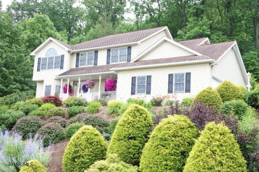 Better than new 2-Story in Beverly Hills.  Kitchen has updated flooring, pantry, recessed lights and quartz countertops.  Hardwood flooring through out the first floor...pocket doors between living room and family room add to the charm.  Glass doors from kitchen lead you to the private patio and backyard.  Many updates throughout...extremely well maintained.  Finished Lower Level boasts a half bath.  Beautifully landscaped with a mix of hardy perennials and a custom stone retaining wall.....and a great view!!!