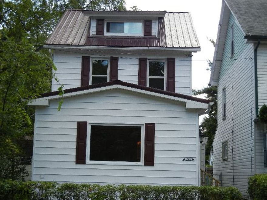 House totally redone, new roof, new drywall, new paint, new complete bath, new first floor laundry hook-ups, new interior doors, new exterior door. New windows in attic, bath, laundry room and basement, new sewer drains, new plumbing. New 50 gallon hot water tank. New 95% efficient furnace, new carpet, new vinyl. Refinished hardwood floors, new electric service, new hickory kitchen cabinets, new range hood, and new finished attic.