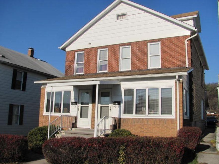 Windber- Live in one side & rent the other side of this 2 story brick duplex with remodeled kitchens, newer furnaces, new roof & all appliances included. 2 car detached garage.