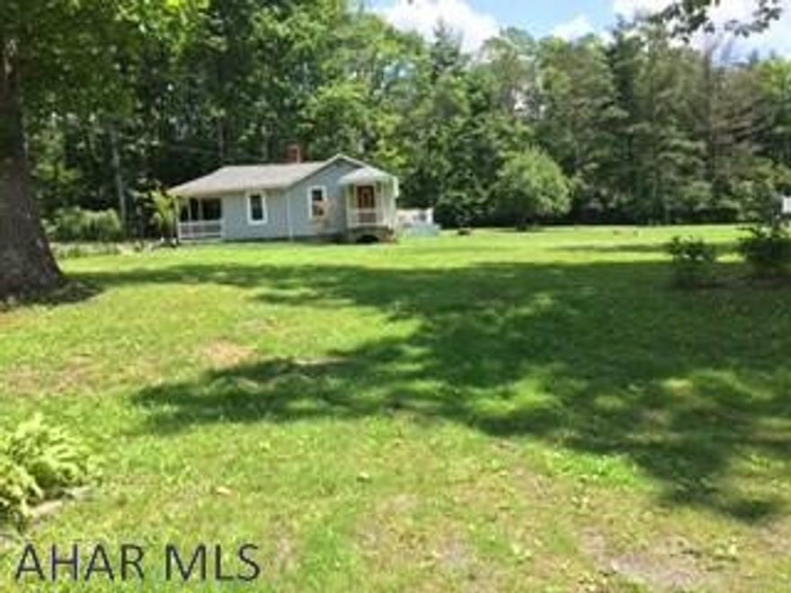 Cozy one story 3BR 1BA situated on 5 pristine flat wooded acres.