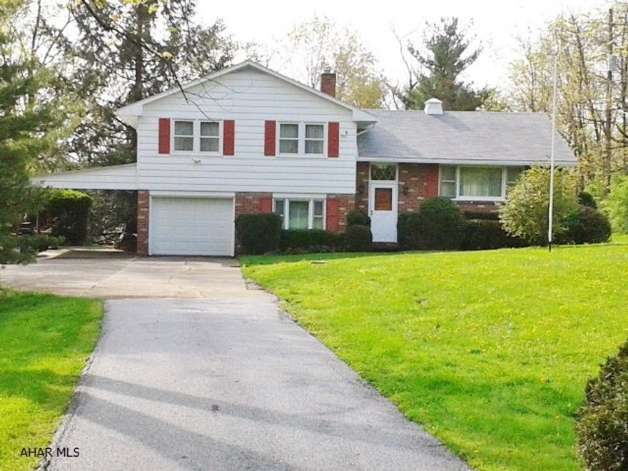 This 3 bedroom, 1.25 bath, split level home offers a country setting with city convenience. Located in Eldorado on 2.67 acres, this home has unfinished oak hardwood floors under 1st & 2nd level rooms. This is a one car garage & carport, with covered back patio overlooking a beautiful & private yard. Newer heat pump, central air, wired for sound, and a roof less than 5 years old. Enjoy this private setting with only one utility bill per month.