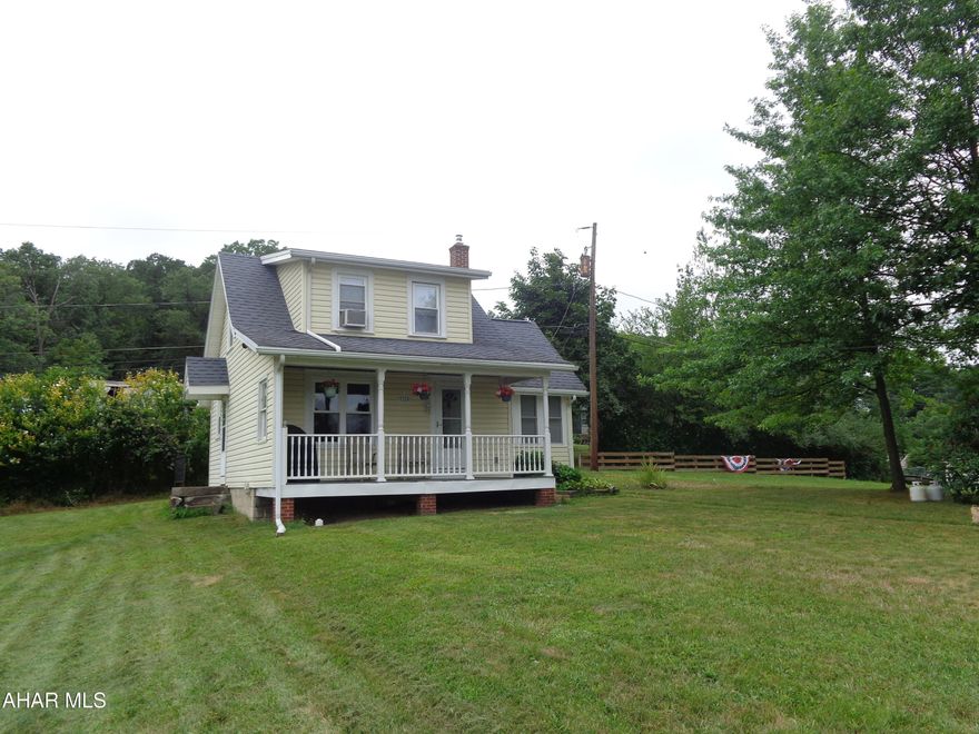 Cute as a button this cozy 2 bedroom, 1 bath home has a 1 car garage.   Charming Cape Cod home is located in Calvert Hills &  sits on .42 acre corner  lot.  Lots to LOVE here!