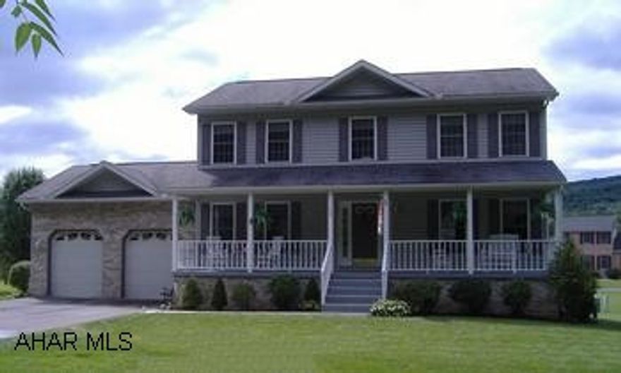 Lovely 2 story Old Town Village Charming Front Porch flat lot.  Immaculate interior. Brick & Vinyl 2 story- 4 bedrooms, 2.5 bath , 2 car garage.  Cherry kitchen, covered front & back porch.  Hollidaysburg Schools.  Must see!