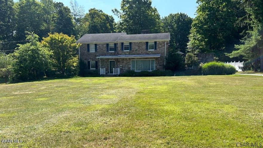 Built in 1948, this charming stone 3-bedroom, 2.5-bath home blends comfort, space, and serenity. Set on a 2-acre lot, it offers ample room for outdoor activities and relaxation. Enjoy a warm interior with a spacious layout perfect for entertaining. The kitchen and dining area cater to culinary needs, while both the living room and sunroom feature cozy fireplaces. Three generous sized bedrooms, a lower-level den adds extra space and 2.5 baths. Outside, a concrete patio and bunk house invite gatherings. Additional perks include a 2-car garage and an oversized garage building with 12 ft doors for RV/boat parking. Conveniently located near local amenities, this peaceful retreat awaits your visit—schedule a showing today!