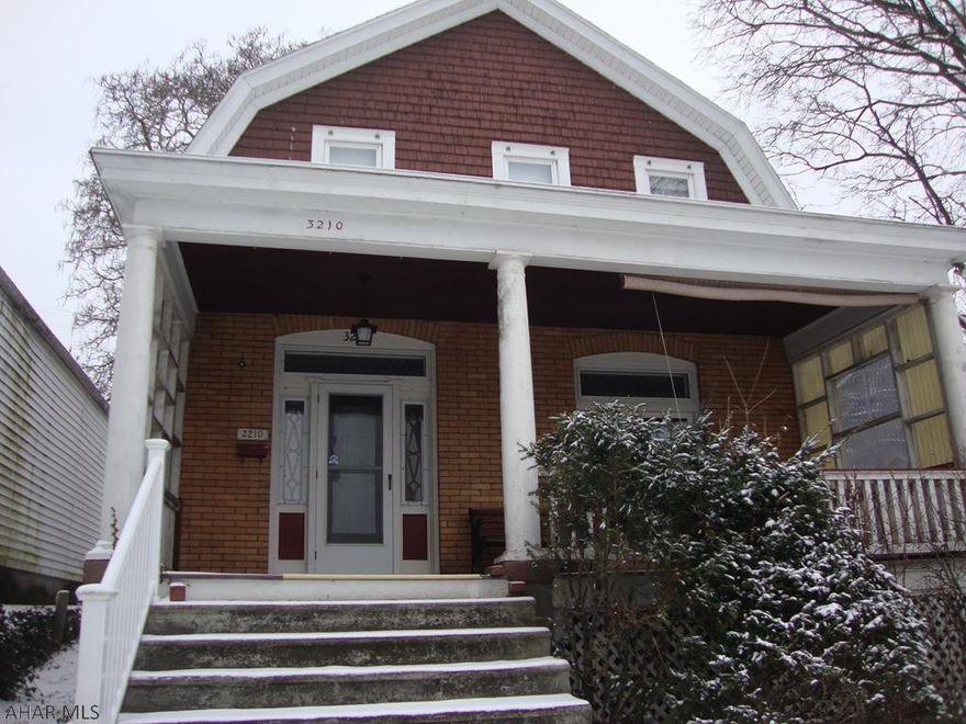 Classic yellow brick Dutch Colonial style 3 bedroom, 1 bath home with covered front and back porches located near the Toy Town section of Altoona.  Home is handicapped accessible with ramping and chair glide.  Gas hot water heat.  Spacious living room.  Panoramic view of Altoona from front living room window.  New washing machine purchased 10/18.  New window A/C unit never out of box included.  Cabinets in kitchen and wardrobe in dining room stay, as does dehumidifier and upright freezer in basement and porch swing.