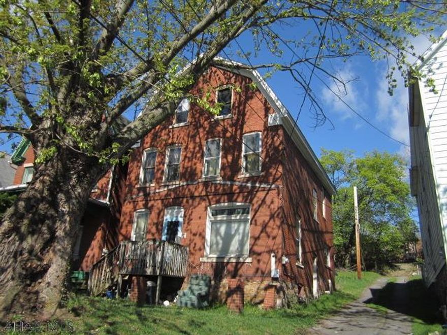 Large 2.5 Story brick home in need of major TLC, but conveniennt in-town location. Loads of possibilties and close to Jaffa. AS-IS sale. Seller will make no repairs.