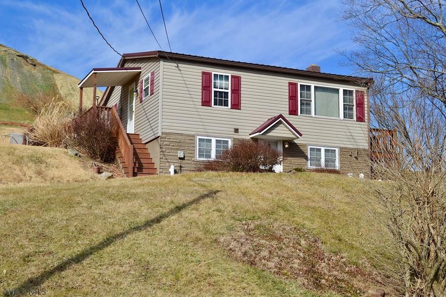 Move-in-ready ranch home in Everett School District.   Spacious kitchen with oak cabinets, appliances included, opens to a side deck and fire pit area.  Vinyl sided, metal roof, detached parking with a 1 car detached garage.   Affordable taxes!