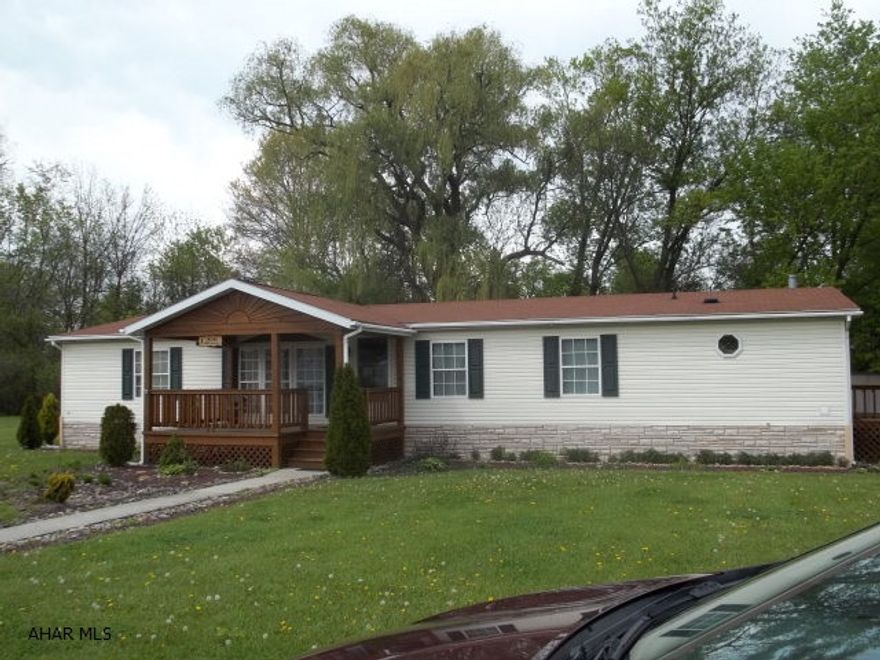 Super large doublewide on an oversized lot.  This house has a large private deck facing the woods and an oversized covered front porch, super large eat in kitchen with an island and tons of storage with ajoining family room with gas fireplace, three large bedrooms with large closets, living room and dining room with oversized windows.  Lot rent covers trash and snow removal, water and sewer.