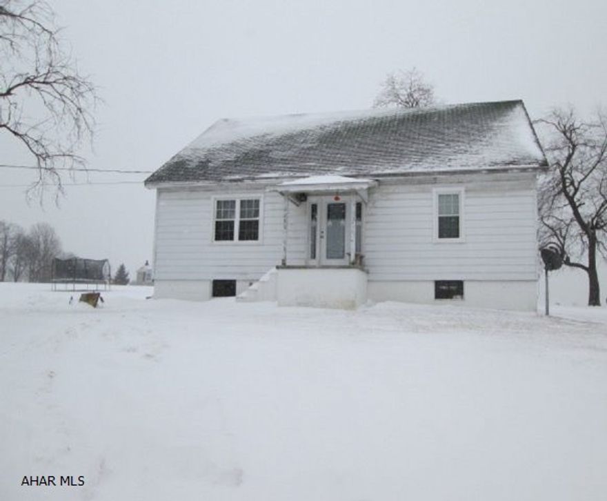 The remodeled interior in this 3 bedroom and 2 bath house is absolutely beautiful!  Eat-in kitchen has new maple cabinets and ceramic tile flooring.  Appliances were purchased new in 2012.  House has first floor laundry.  First floor bath has plenty of cabinets for storage.  Large master bedroom.  Double sink in second floor bath.  New carpet installed in 2012.  Huge yard with 2 sheds.  Home is heated with an outdoor wood furnace.  Save hundreds each winter burning wood instead of oil!!