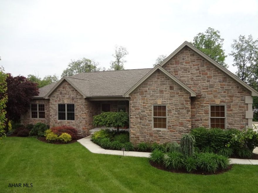 Stunning 3-bedroom, 3.5 bath ranch home in a great neighborhood.  Less than five years old, this home has everything to offer.  Meticulously maintained and landscaped on nearly one acre.  Hardwood floors and top of the line appliances.  Large finished basement with 18 foot wet bar.  Raised platform for stadium seating.  Covered deck in rear.