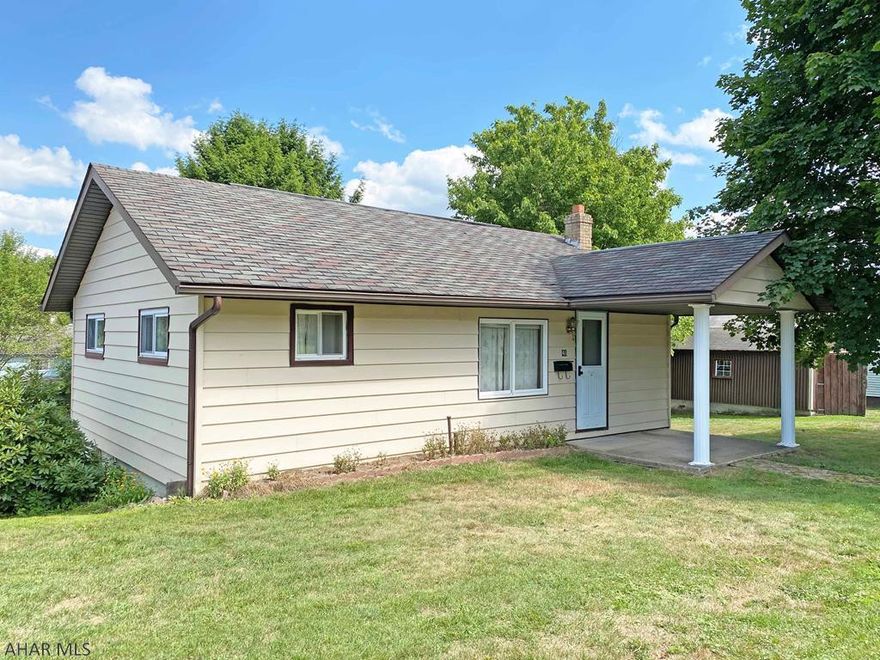 Easy 1 floor living in this 2 Bedroom vinyl sided Ranch. Living Room with ceiling fan and built-in bookshelves, Dining Room. Oak Kitchen includes the range and refrigerator. Convenient main floor Laundry room. Vinyl windows. Rear deck and nice yard with alley access. Hot water heat. 1 car detached garage plus carport.Covered front porch. Call soon!