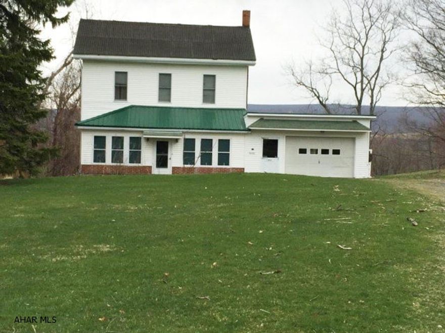 Large Vinyl sided 2 1/2 story home on 1.4 acres with great views! This home offers over 1800 sq ft. of living space that includes LR., DR., kitchen, full bath, bonus room and bedroom on the first floor, plus 3-4 bedrooms and half bath on the 2nd floor! covered deck to enjoy the mountain views.