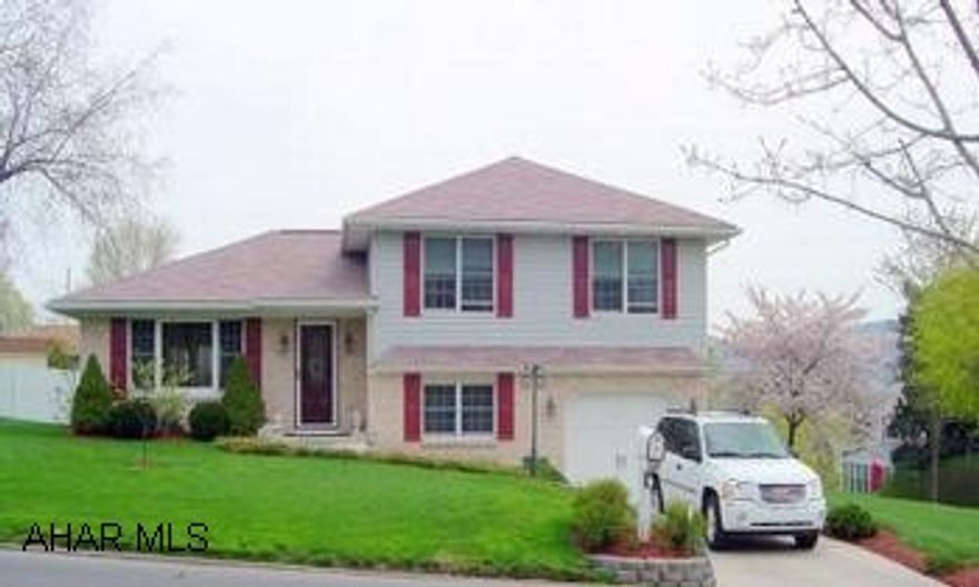 A "Stand Out"- Quality throughout  this beautiful split level with  3BR, 3BA, Oak & tile Kit, Breakfast bar, Dining Area to lovely deck, FR w/gas FP, Laundry, storage, 1/C Int & 1/C Det. Garage, CA, window cov., kit. appliances, 100x120 lot, perennials & trees...Move-in Condition.....$174,900...Please Remove Shoes.  Call Janet Burley  814-942-3112.