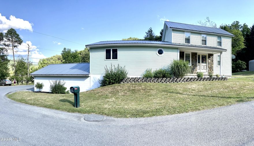 This 3 bedroom, 2 full bath home is situated on a beautiful, cleared 2 acre lot and complete with a new metal roof, new windows, two car garage, large covered deck, goldfish pond, basketball court, 6 apple trees and an additional 8 acres of woods to explore or expand into the property of your dreams. The large kitchen features beautiful oak cabinets and stainless steel appliances. Enjoy new hardwood floors, vinyl and carpet throughout the main floor which features a family room, dining room and large living room with vaulted ceilings and sliding doors out to a large deck. The first floor bedroom has an adjoining bathroom with two additional bedrooms upstairs. Enjoy the finished basement which has a gas fireplace with stone surround. Additional attic and cellar spaces offer storage solutions.