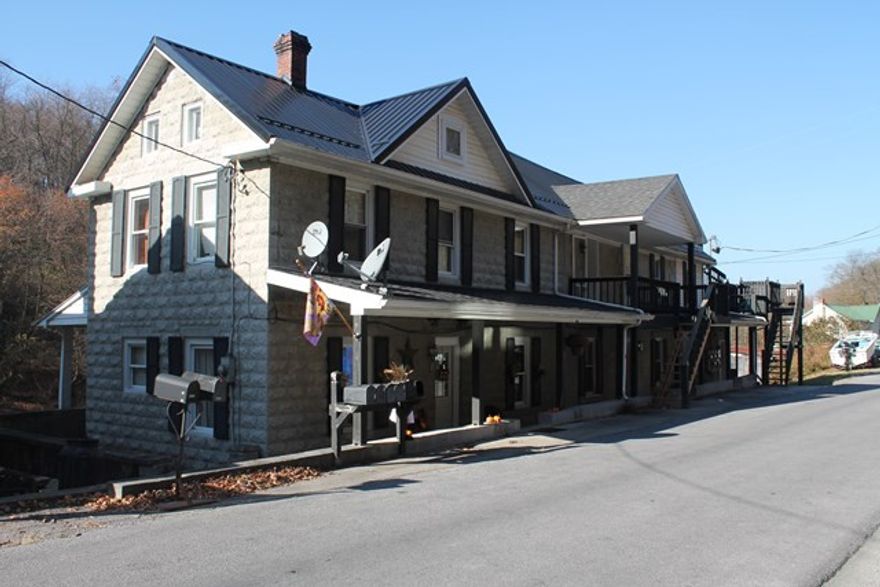 Great first time investment. This apartment complex  has a house on the left, attached are 4 apartments and 1 efficiency. Needs a bit of TLC .
