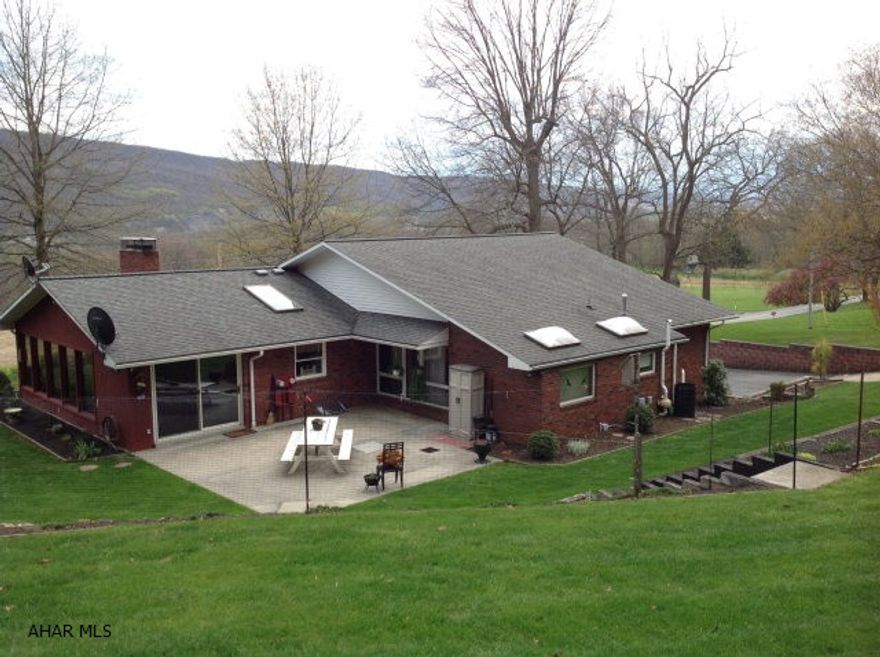 Custom brick built ranch home on 4.66 acres with faboulous view of the mountians and convenient location to shopping and the hospital!! Beautiful custom cabinentry in the kitchen with new appliances and built-in pantry. Sunroom heated with new woodburner and surrounding views. Spacious bedrooms with double size closets and new carpeting/flooring. Large master suite with new master bath/skylight. Finished basement for entertaining or Rec. room or a Mother-in-laws suite with seperate entrance for privacy!! Spacious utility and laundry room. Integral 2 car garage with storage/work area. Beautifully landscaped with a garden, large shed for outdoor storage and maintained woods with abundance of wildlife. Very large outdoor patio and private!!   Radon Mitigation system.