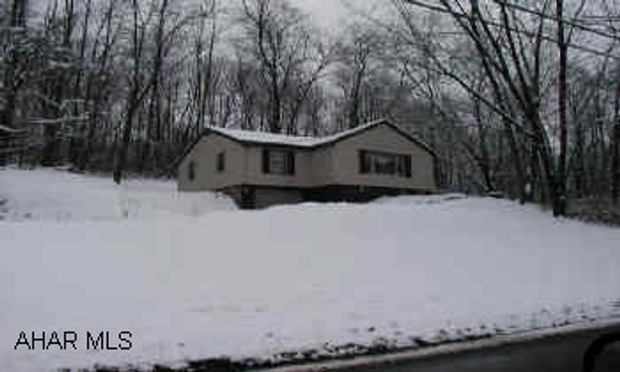 One story frame, new vinyl siding, good shingle roof, 1 car basement garage. Great 1.17 acre wooded lot sale to be "As is" condition, now tenant occupied.