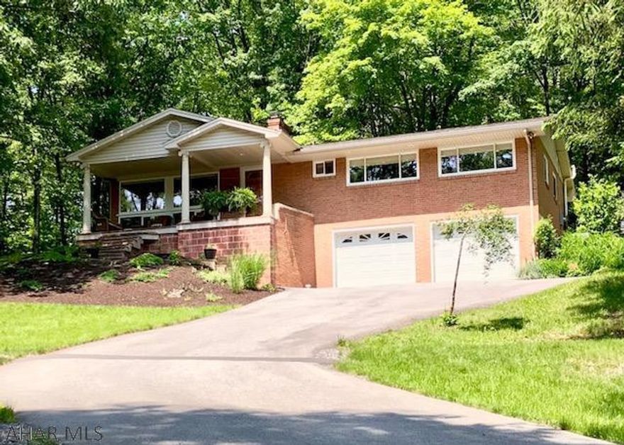 Immaculately maintained!!  Very private, secluded, convenient location!  This well built 1960 brick home on 2.74 acres, designed with the plans by Thomas Barr  (Architect of Seattle, WA) has been totally remodeled but leaving the original floors and plaster walls in tact. A solid house with great bones!. Large windows in every room gives an abundance of natural lighting and views. This 2 bedroom, 2 bath home has numerous details that need to be seen. Granite counters, island, SS appliances, double ovens, pantry and tile in the kitchen, gives you just a peek of the quality of upgrades. The elevation of this home gives you continuous views from each room which are surrounded by woods. The large, private, brick patio gives you the perfect house for entertaining. This house is a MUST SEE!