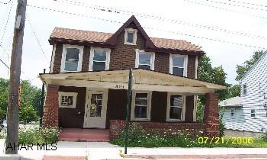 Corner property with great presence. Hardwood floors and french doors. Could be a nice office as well.