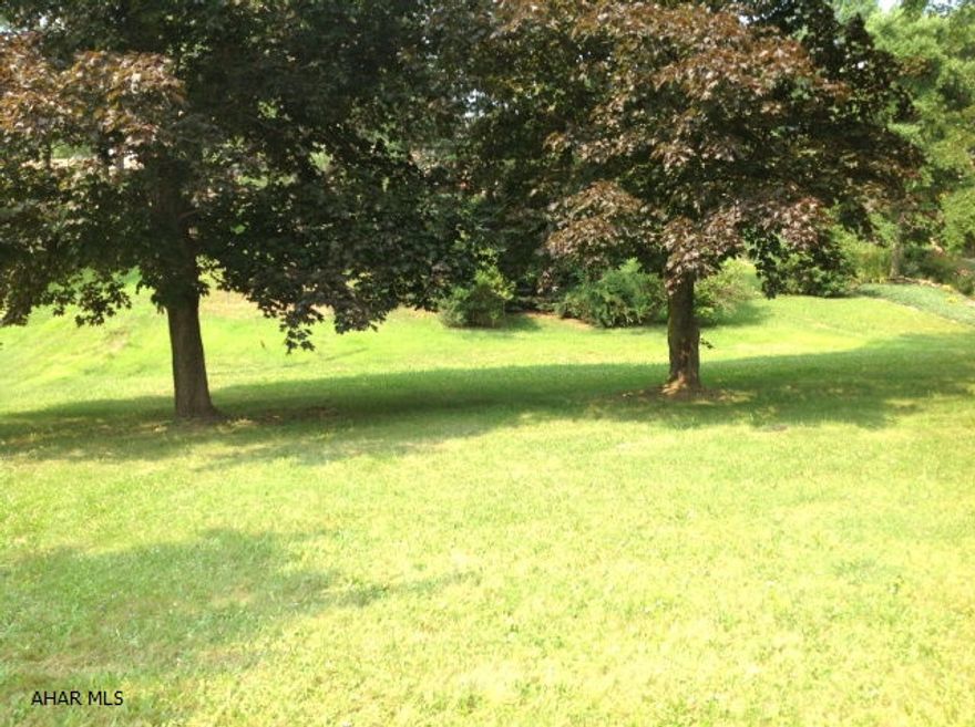 All hook ups and Tap ons for the utilities are already there from a previous existing home.   What more could you ask for at this price. It sets just 5 mins from town in a country setting.  AND... you get public utilities.  This is an easy one for you folks looking to build or put your modular home.   You have a semi private setting with a beautiful front yard landscaped with some spectacular trees on this flat parcel off the quiet road of Maple Hollow.