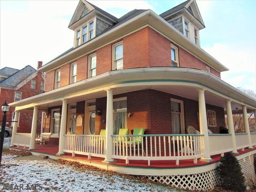 Looking for a larger home with traditional charm? With original built-ins, pocket doors and pine wood floors throughout you won't want to miss this property with it's garden areas and wrap around porch. 4 Bedroom and 2 full bathrooms there's lots of room to spread out. The attic has huge potential to be renovated into any use you can think of! Did I mention the finished apartment/mother-in-law suite in the basement? There's room for multiple cars to park on the cement/paved parking area behind the house also. Make an appointment to see this house! It's being sold As-Is and is listed below it's assessed value. This one won't last long!