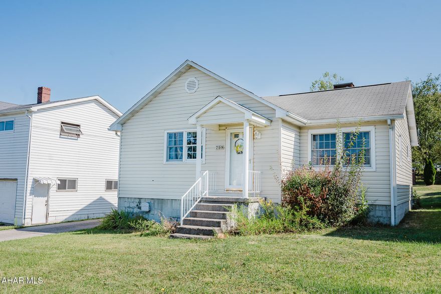 This split level 2 bedroom (room to make a 3rd bedroom on lower lever) has 1 & 3/4 baths. The property features a propane insert (but could be switched back to a wood) burning fire place on lower level and a 3 season sun room that lets air in and keeps bugs out (it sits behind the home 18.4 x18.4). The home has a cold closet for your root veggies, sodas/drinks. Parking--it has a 1 car garage + driveway that can fit 2-3 more cars. The workshop attached to the garage is waiting for you and your projects. Store your holiday  items in the large attic; and the home has good closet storage too. The home was built with great insulation and currently has electric heat and gas line is outside if you want to switch and add a gas furnace. The yard is fenced and also has an additional storage shed.
