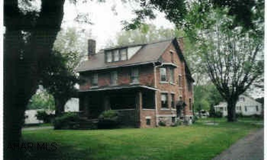 Beautiful 2 1/2 story brick traditional on tree shaded lot with 4BR/1BA, formal dining room w/built-in china closet, French doors, living room w/fireplace, 2 sunrooms, partially finished 3rd floor. Property includes an extra 139'x169' lot with 2-car garage.