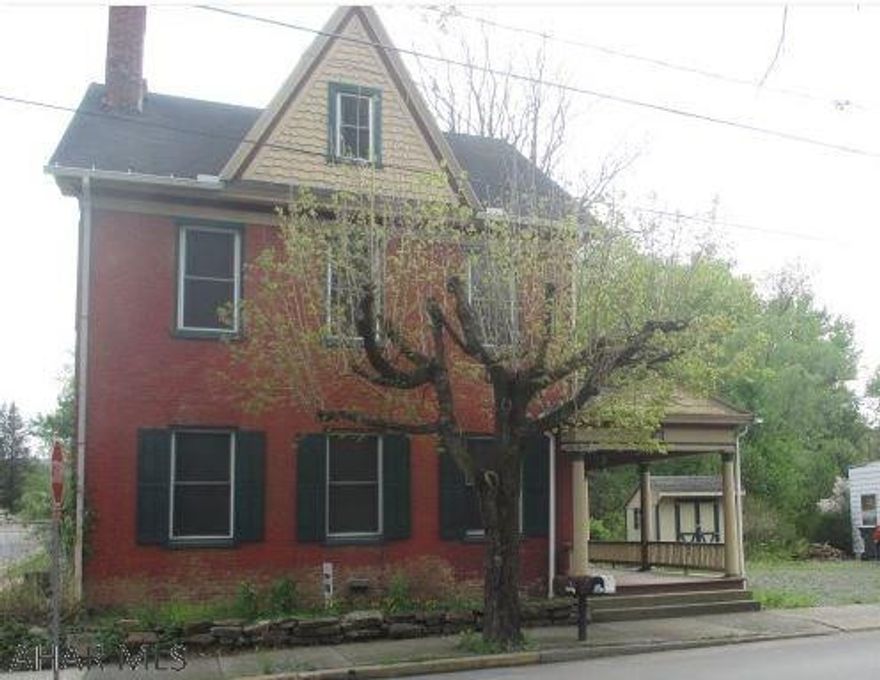 Huge historic 2 Story solid brick Federal-style Alexandria home. Walk out your back door to the Juniata River! Oak hardwood and ceramic tile floors. Covered front porch, large level yard backs up to the river, finished attic, den with fireplace. AS-IS sale.