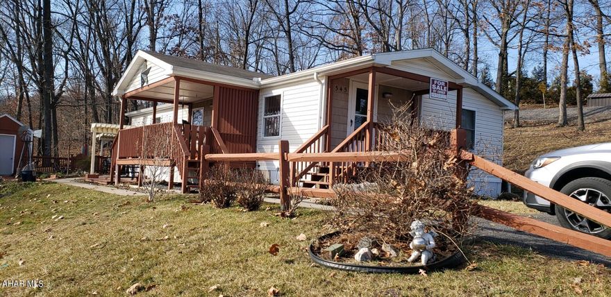 This immaculate home has been re-finished with dry wall, newer flooring, tile, and a completely upgrading kitchen. It features 2 bedrooms and a bonus room that can be used as a bedroom or utility room; as well as 2 full bathrooms. Enjoy sunsets on the covered front porch or entertain guests in the landscaped side space. This is a must see mobile home on leased land.