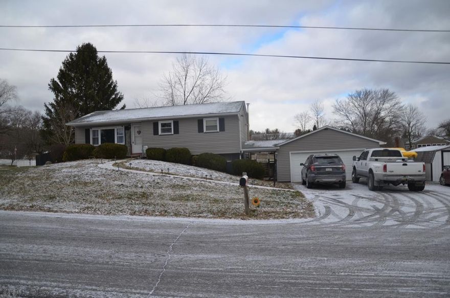 Cute and cozy ranch home nestled in a quiet neighborhood. This home features hardwood floors through out, 3 heat sources, fenced in back yard, back deck, breezeway from garage, ample amount of parking and close proximity to everything in town. Garage is heated and is 23 x 25. Don't wait to view this home, schedule your showing today before it's gone.