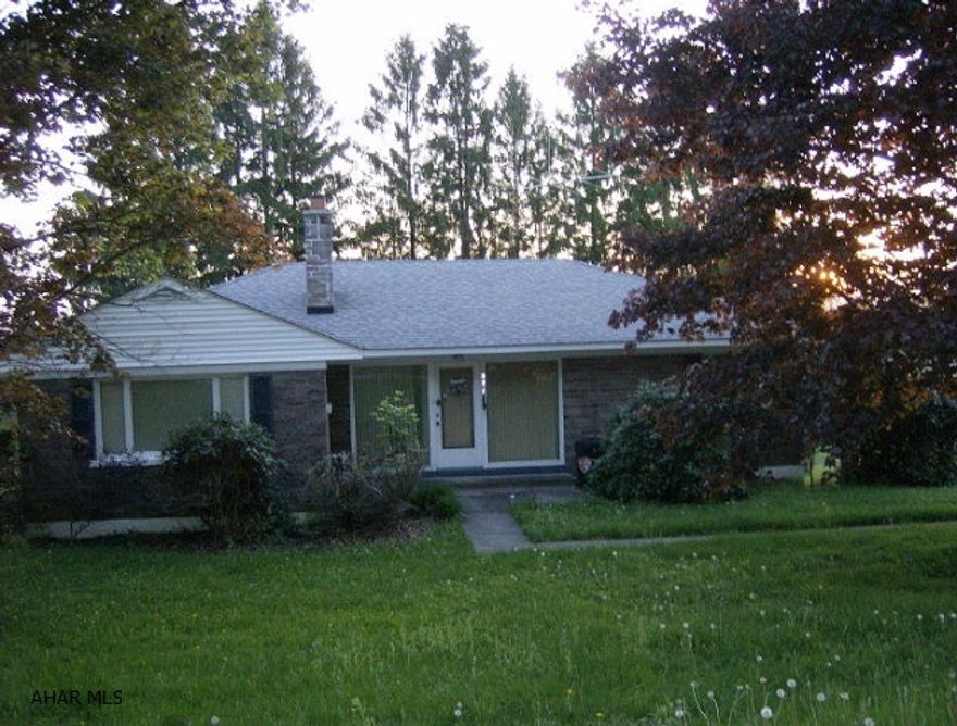 Just outside Ebensburg ranch stone home on 1 acre. Fireplace in living room. Sunroom. Separate oil & hard coal heat. Full basement. 2 car attached garage. $129,900