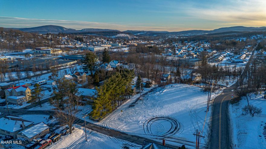 Build your future on this level 0.88-acre city lot in Altoona. Public water, sewer, and electric are available at the street, offering a convenient setting for residential development. Located within the City of Altoona, this parcel provides easy access to city amenities while offering a spacious lot size rarely found in town. Buyer to verify utilities and intended use.  

Zoning is RN-A (Residential Neighborhood A) Seller had a variance to construct a storage garage for personal use, however this expired because he didn't build before the variance expired.