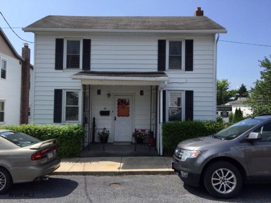 Two story home in move-in condition. Fenced yard with beautiful landscaping. Large kitchen with spacious pantry. First floor has gorgeous hardwood floors, rear covered deck, and front covered porch. Wonderful starter home or good investment in a friendly neighborhood. Propane heater included. Motivated seller!