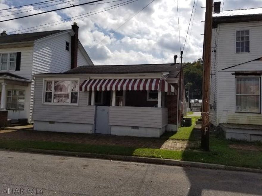 Cozy 2 bedroom brick rancher with modern kitchen and bath. Heated sunroom. Gas forced air heating system with central air conditioning. 1 car carport.