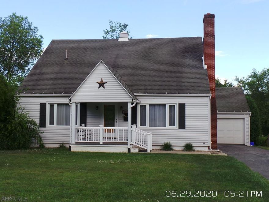 Cozy & nicely decorated 4BR-2BA home with hardwood floors, large kitchen includes appliances.  Nice screened back porch and private back yard.  1 car garage, large basement for storage.