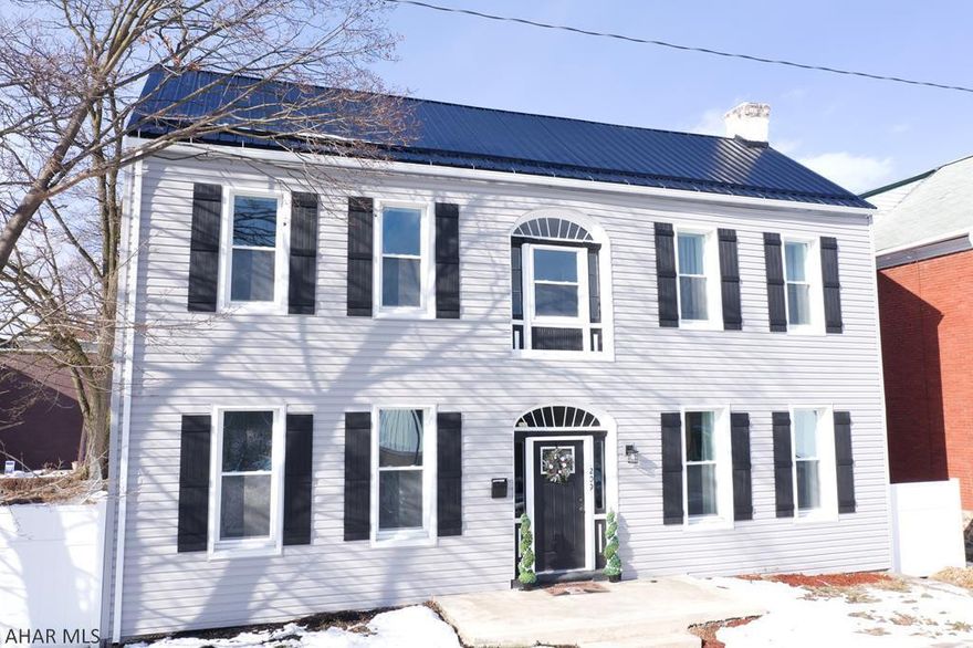 Upon entering this beautifully updated home in Hollidaysburg you will find an open foyer with ceramic tile leading to two large living rooms, one with a decorative fireplace, the other can be used for a home office or sitting room. Down the hallway you will find a vastly open eat-in kitchen and dining area. There is also a full bath on the first floor that has been beautifully renovated. At the top of the stairs is a sun room area with views of Chimney Rocks. Each of the three bedrooms provide plenty of space with nice sized closets. This home also includes three off street parking spots and a back deck, great for relaxing and entertaining outdoors! Updates within the last year include: flooring, kitchen, paint, deck, roof, siding, furnace, water tank, plumbing, and electrical.