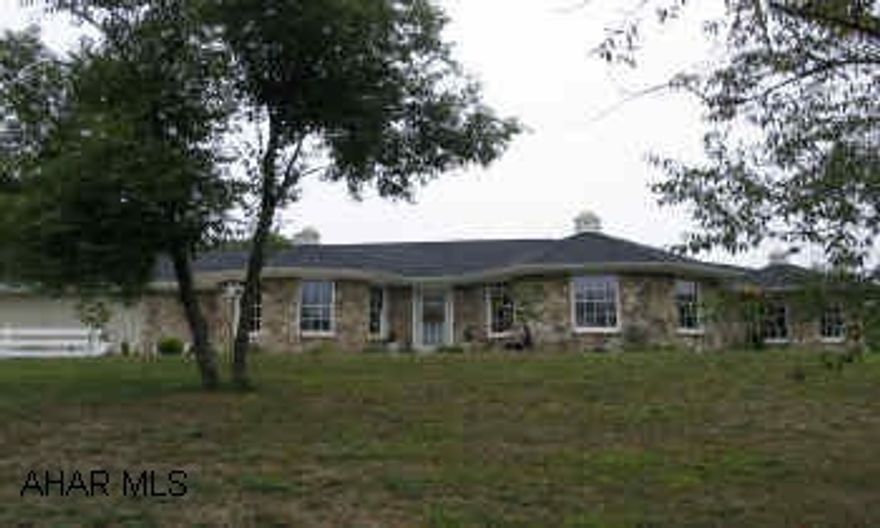 Custom stone/vinyl ranch overlooking pond; situated on3.79 acres; tranquil and private setting. Dramatic vaulted ceilings and windows provide light and airy ambiance. Master Suite has jacuzzi, shower, and walk in closets. Laundry on main living level. Garage has pull-down storage above.