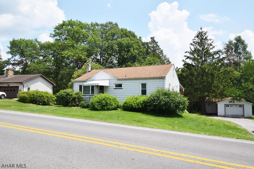 Really nice and well maintained  home with updated kitchen  just minutes to shopping in Altoona or schools in Hollidaysburg. Basement with so much potential.   Covered deck off kitchen and three season enclosed sun porch.  Large private lot that runs all the way to small creek in the rear of property.  Additional garage/building could be hobbyists workshop, woodshop, or just plain fun mancave or sheshed.