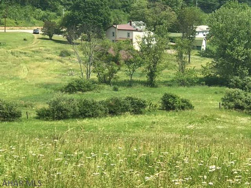 Updated farmette with 10 scenic acres. Enjoy the comforts of country living in this updated farmette with 10 scenic acres which include walking and or riding trails that take in gorgeous panoramic views of the Allegheny Mountains. Updates include metal roof, refinished flooring, thermo pane windows, siding, sink, interior painting, bathroom vanity, sink and toilet, wiring, hot water baseboard heat and newer sand mound and new well pump. Property also includes a main floor master bedroom, a 5 stall horse barn, fenced acres, tillable acres, stream and pond. so much for so little. A must see property located between Cumberland MD and Historic Bedford. Move in ready!