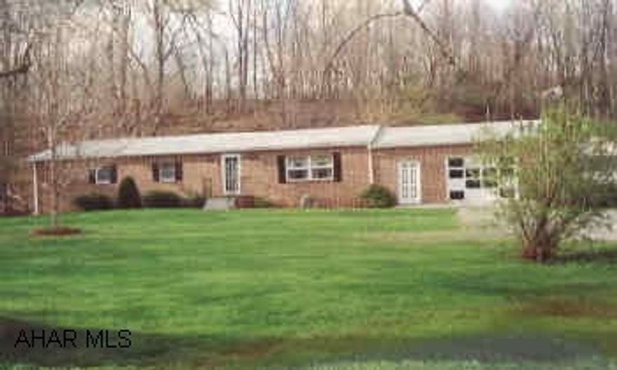 Brick ranch, level lot, meticulous, beautiful decor. Large rear deck W/ convertible awning. 3/4 acres