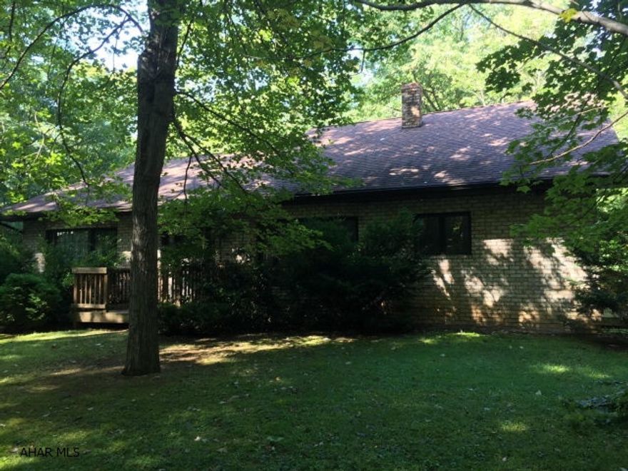Diamond in the rough. This LARGE Ranch with 2nd floor loft sits on 16 acres of uncut timber. Built in 1980, this house was never finished...it's waiting for you to make it your own. 2 Large BR's on the main floor, Master suite on the 2nd. Huge wrap around deck, wood stove, Huge formal dining room, sunken living room, Large bedrooms, Big closets, Den/office in finished basement could be 4th BR. The potential in this house is unlimited. One owner and timber has never been cut. Loads of storage space, integral garage & much more. This house needs wokd, but the potential is amazing! **Ask listing agent about estimate for select cut**