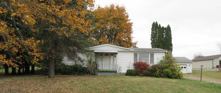 Osceola Mills modular 1 story on permanent foundation w large 2 car detached garage. Needs work throughout, but loads of possibilties in nice area. AS-IS sale. Seller will make no repairs.