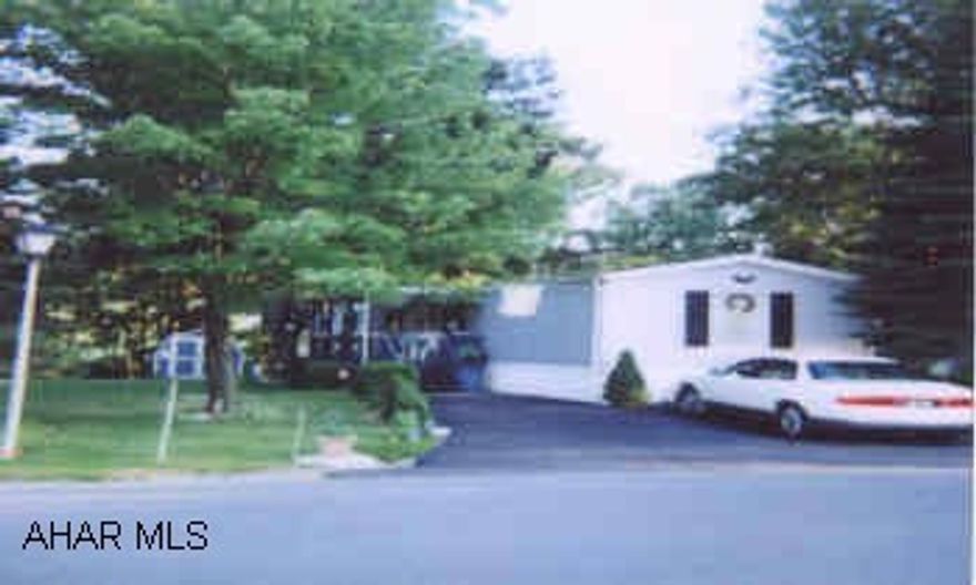 LOW MAINTENANCE, LOW UTILITIES, 1994 SKYLINE 14X76, MINT CONDITION, LOOKS NEW, WELL MAINTAINED, SHINGLE ROOF, CENTRAL AIR, SHED, MACADAM DRIVEWAY, PRIVATE BACKYARD, LOW TAXES, UTILITIES AND MAINTENANCE.  SELLER MUST FIND SUITABLE HOUSING.