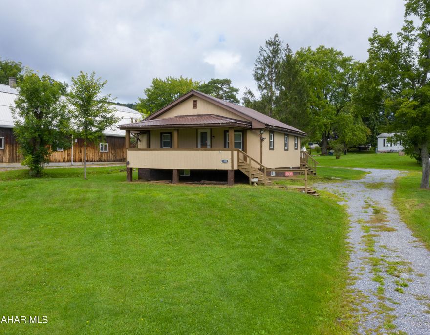 Quaint 1 story home situated on almost a half acre with beautiful views and a great location!  Inside has been completely updated including new flooring, bath, and Kitchen.  Brand new well pump was just installed.  This would make a great home for anyone looking to down size, or a perfect investment property!