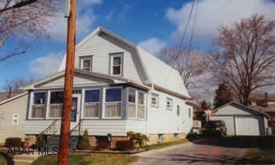 IMMACULATE HOME WITH LARGE MODERN KITCHEN, NEWER WINDOWS, FURNACE, ROOF, AND WIRING. NEW WATER & SEWER LINES IN 1991. FIRST FLOOR LAUNDRY AND 1/2 BATH. ENCLOSED FRONT PORCH FINISHED & HEATED. CLOTH AWNINGS TO COVER PATIO. HEATED ABOVE GROUND POOL IS NEGOTIABLE. ATTIC ACCESS.