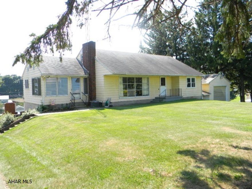 This spacious 1 1/2 story home offers a beautiful country setting with pleasant views. Relax in the LR with a wood FP or enjoy the views out the picture window. Efficient kit. with eat-in area, dining area, 3-beds and a full bath on the main level. Second level offers two finished bonus rooms. Basement is partially finished with a large rec. room, kit area, full bath and family room. 1-Car attached garage, 1-car integral garage and 2-car carport. Oil FA heat, central-air, updated hot water heater and 100-amp electric.